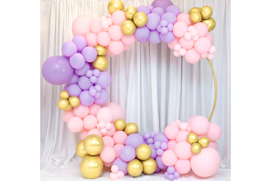 Pink, purple and gold circle balloon heart arch rental.