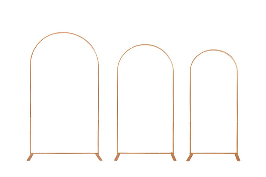 Three gold metal arches on a white background