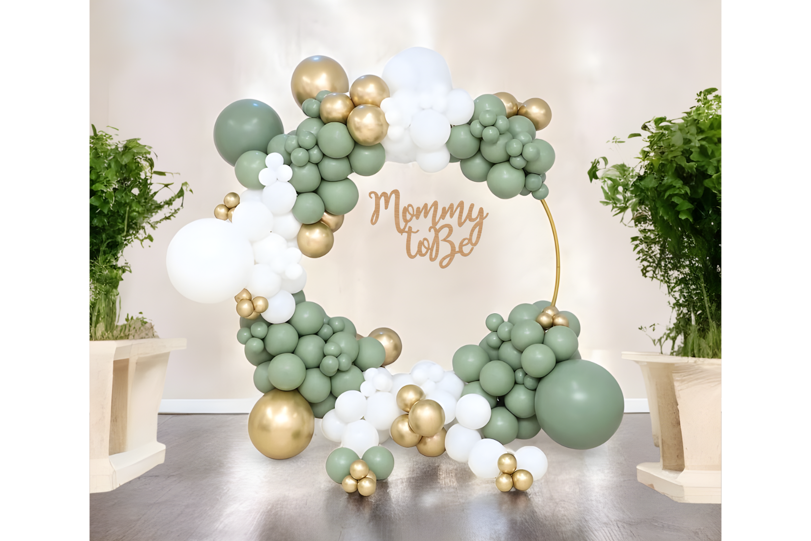 Green, white and gold circle balloon arch for boho safari baby shower