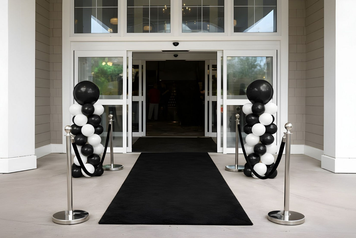 Black and white balloon column for grand opening event.