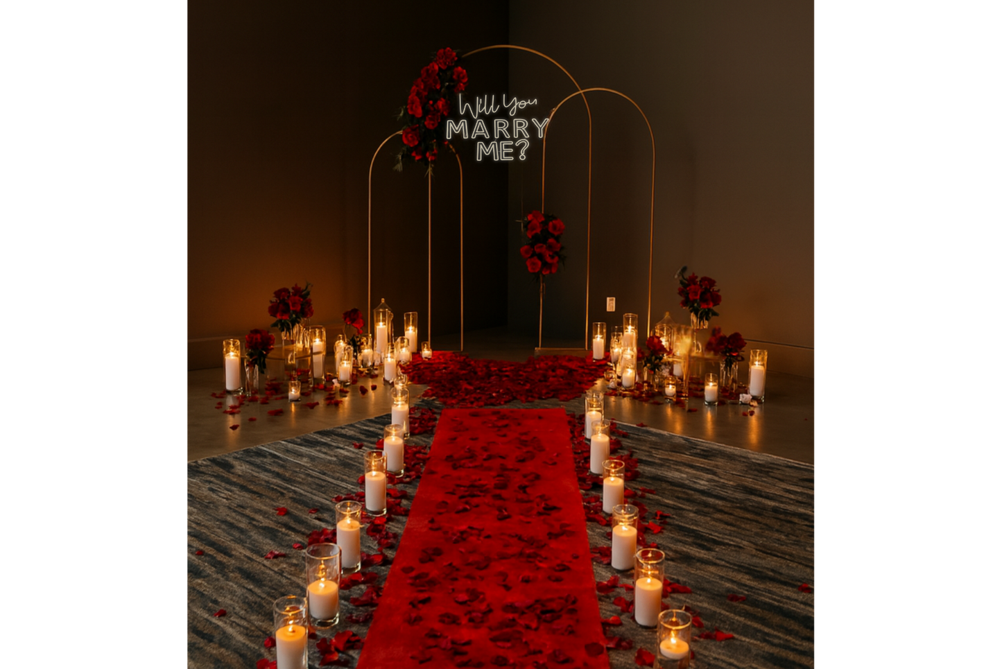 Romantic proposal setup with red carpet, candles, and 'Will You Marry Me?' sign.