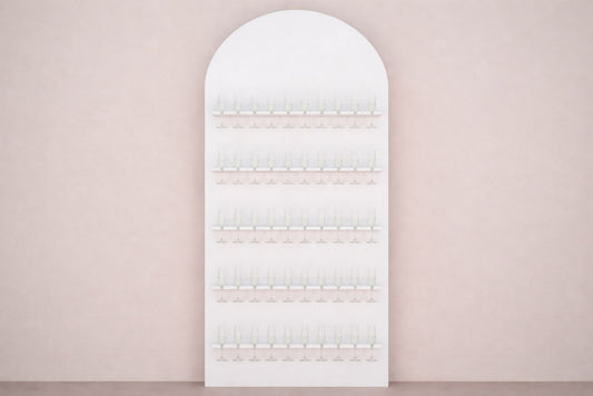 Arched white champagne wall on a light pink wall