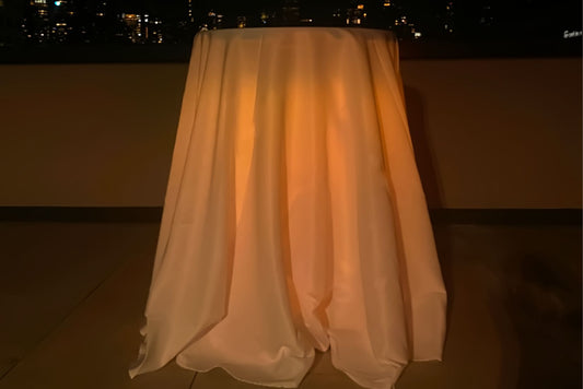 Highboy pub table with draped cloth and amber lighting. Table is for rent in PG county maryland
