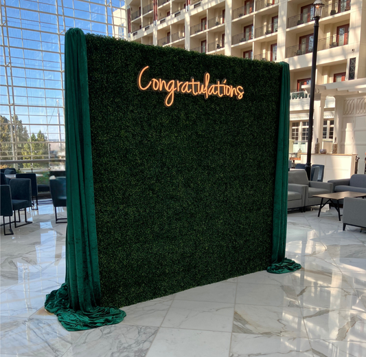 Grass wall with congratulations neon sign at Gaylord National Harbor Belvedere Lounge