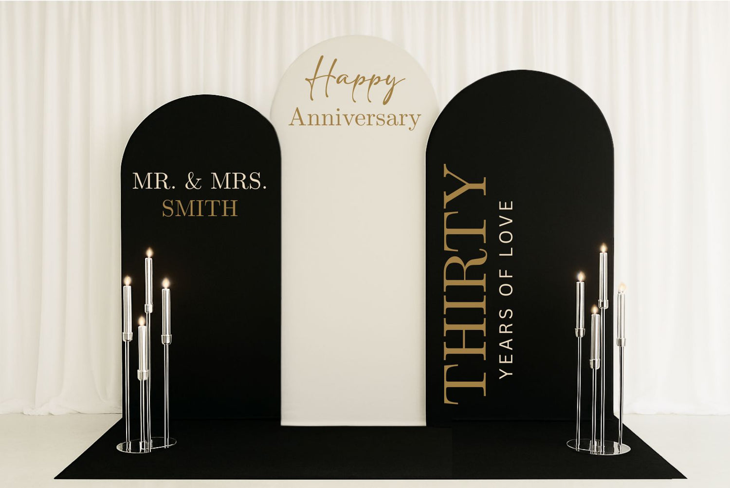 Custom anniversary arches with name, anniversary year and custom celebration text. Also has LED candelabras and black carpet.