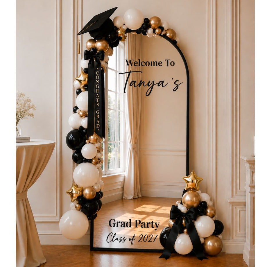 Decorative selfie-mirror with balloons and text for a graduation party in a venue room in Maryland.