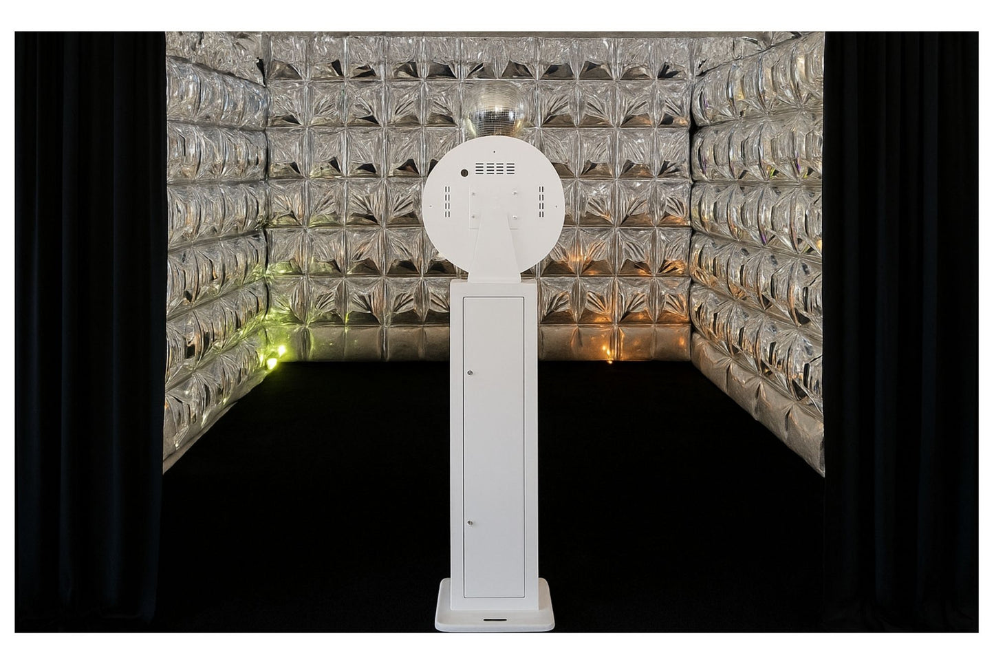 White open-air photo booth in front of reflective mirror balloon cube enclosure
