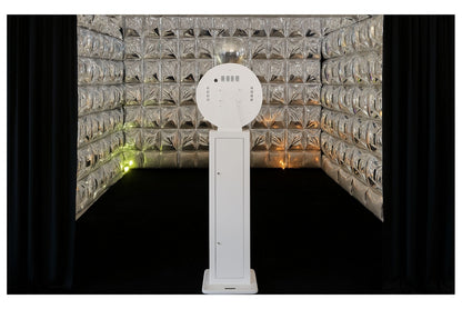 White open-air photo booth in front of reflective mirror balloon cube enclosure
