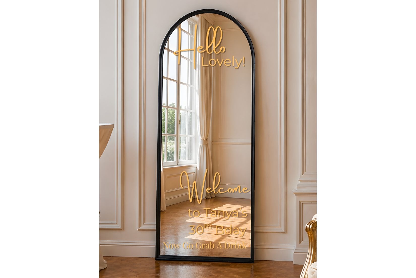 Full-length mirror for rent with decorative text in a room with white walls and wooden floor.