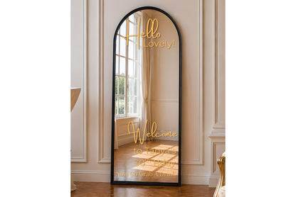 Full-length mirror for rent with decorative text in a room with white walls and wooden floor.