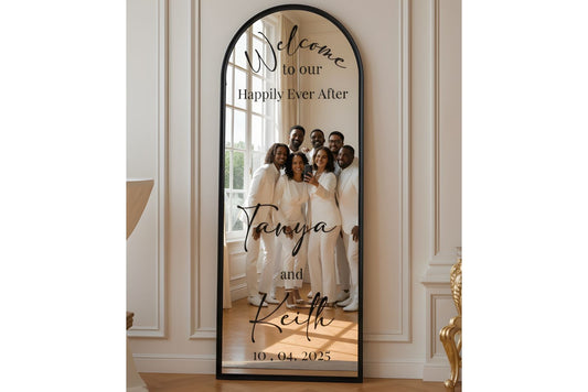Decorative mirror with family photo and text in a home setting