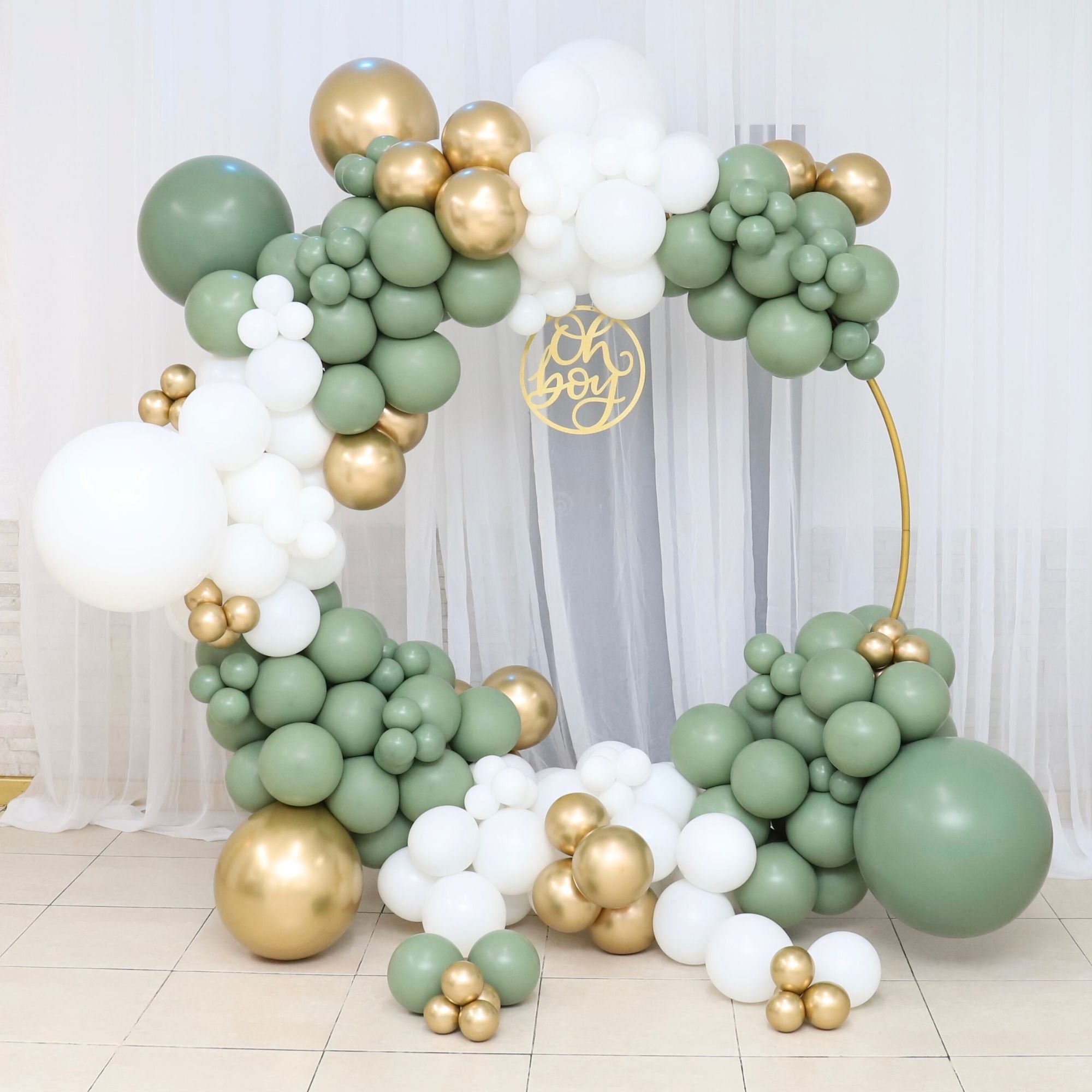 Oh boy baby shower ballon garland with green, white and gold balloons.