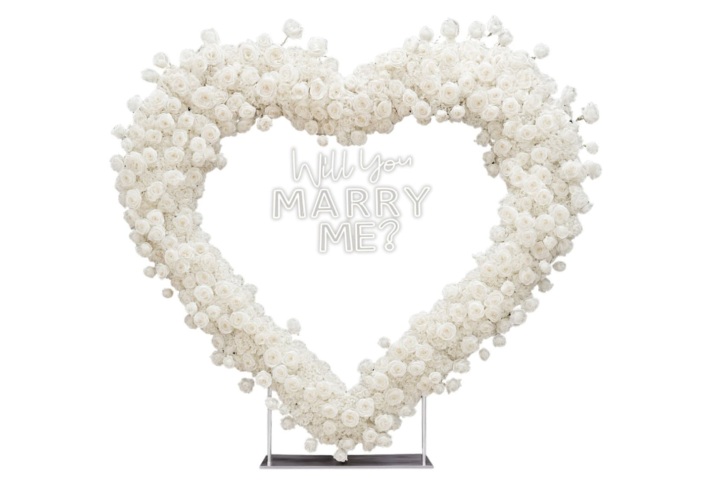 Heart-shaped white rose backdrop with large 'Will You Marry Me?' neon sign