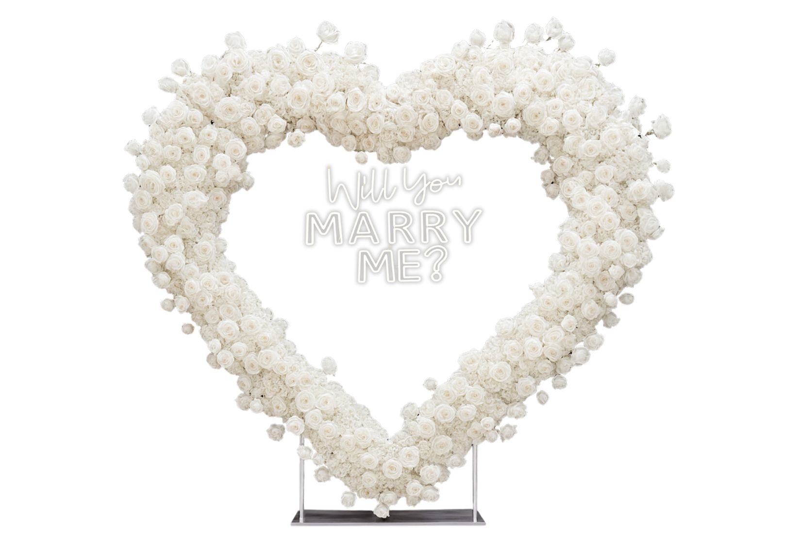 Heart-shaped white rose backdrop with large 'Will You Marry Me?' neon sign