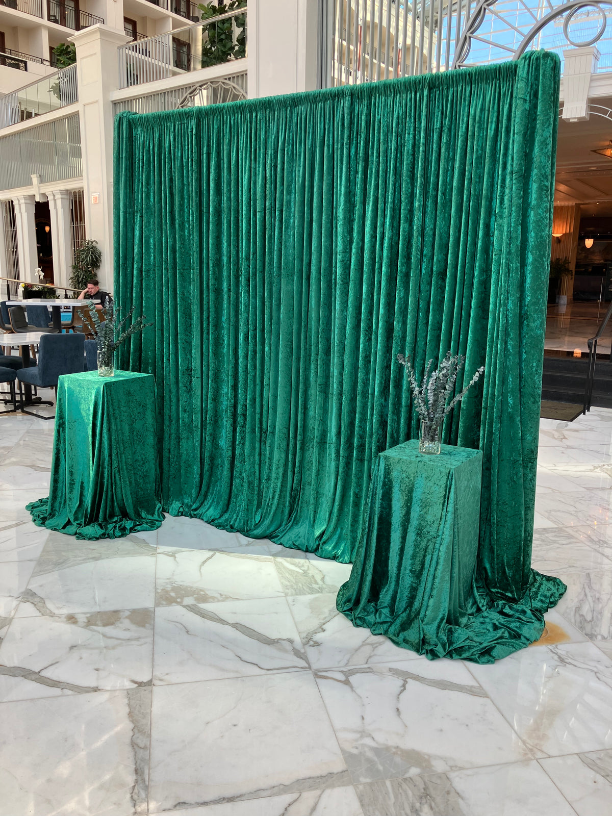 Green velvet draping with pedestals for venue room divider at Gaylord National Harbor