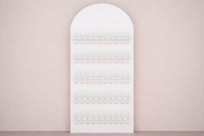 Arched white champagne wall on a light pink wall