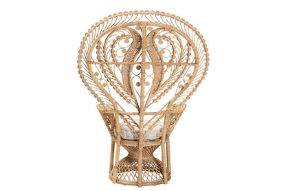 Back view of a Wicker peacock chair with white cushion.