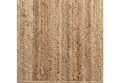 Boho inspired jute wicker rug with natural brown tones.